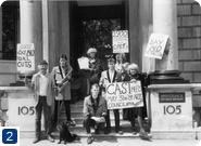 Photograph of Roland and Claire Muldoon, CAST and the Left Wing Teds dressed in their Double Bill guises, protesting outside the Arts Council of Great Britain, [1984].